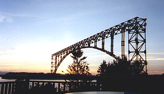 K'nex Arch Bridge, about 10 feet long, at sunset, with Whidbey Island in the background